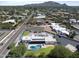 Aerial view of the property highlighting the solar panels, pool, large yard and well-maintained landscaping at 10024 N 61St Pl, Paradise Valley, AZ 85253