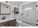 Modern bathroom featuring a glass-enclosed shower and stylish vanity with lots of storage space at 10024 N 61St Pl, Paradise Valley, AZ 85253