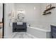 Well-designed bathroom with stylish vanity, soaking tub, and tiled flooring at 10024 N 61St Pl, Paradise Valley, AZ 85253
