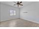 Well-lit bedroom with light wood flooring and a modern ceiling fan at 10024 N 61St Pl, Paradise Valley, AZ 85253