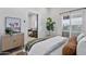Charming bedroom with a view into the living room, featuring shuttered windows and modern decor at 10024 N 61St Pl, Paradise Valley, AZ 85253