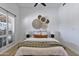 Cozy bedroom with decorative wall art, shutters, and a comfortable bed with stylish throw pillows at 10024 N 61St Pl, Paradise Valley, AZ 85253