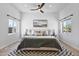 Bright bedroom featuring a large bed, symmetrical nightstands, and modern ceiling fan at 10024 N 61St Pl, Paradise Valley, AZ 85253