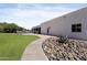 Exterior view of a home with a well-manicured lawn and rock landscaping at 10024 N 61St Pl, Paradise Valley, AZ 85253