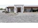 Inviting front entrance showcases a custom wood door, and desert landscaping at 10024 N 61St Pl, Paradise Valley, AZ 85253