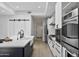 Bright kitchen features a large island with a sink and modern appliances, offering style and functionality at 10024 N 61St Pl, Paradise Valley, AZ 85253