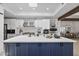 Modern kitchen with white cabinetry, stainless appliances, a large island, and ample counter space at 10024 N 61St Pl, Paradise Valley, AZ 85253