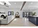 Bright living room features a fireplace, wood beam, and flows into an open floor plan at 10024 N 61St Pl, Paradise Valley, AZ 85253