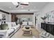 Inviting living room with exposed wood beams, neutral decor, and an open dining area at 10024 N 61St Pl, Paradise Valley, AZ 85253