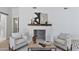 Bright living room with brick fireplace, wooden mantel and stylish decor at 10024 N 61St Pl, Paradise Valley, AZ 85253