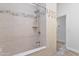 Bright, tiled shower area with bench and showerhead, featuring neutral tiling at 10024 N 61St Pl, Paradise Valley, AZ 85253