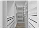 Spacious walk-in closet featuring custom shelving and drawer systems for optimal storage at 10024 N 61St Pl, Paradise Valley, AZ 85253