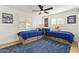 Bright bedroom with two twin beds, built-in storage, and natural light from shuttered windows at 1018 W State Ave, Phoenix, AZ 85012