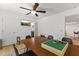 Cozy dining room with a ceiling fan and view to the bathroom at 1018 W State Ave, Phoenix, AZ 85012