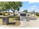 Charming single-story home featuring a large driveway, mature landscaping, and a two-car garage at 1018 W State Ave, Phoenix, AZ 85012