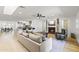 Bright open concept floorplan with hardwood floors, a fireplace, and kitchen barstool seating at 1018 W State Ave, Phoenix, AZ 85012
