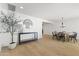 Open-concept living space with an elegant dining area, hardwood floors, and modern decor at 1018 W State Ave, Phoenix, AZ 85012