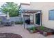 Well maintained backyard features a covered patio, outdoor seating and raised garden beds at 10225 W Camelback Rd # 45, Phoenix, AZ 85037