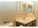 Cozy bathroom featuring a single sink vanity, framed mirror and neutral wall color at 10225 W Camelback Rd # 45, Phoenix, AZ 85037