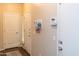 Entryway featuring a key and mail rack, modern alarm system, and neutral color palette at 10225 W Camelback Rd # 45, Phoenix, AZ 85037