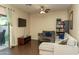 This living room features a comfy gray sectional sofa and a flatscreen tv at 10225 W Camelback Rd # 45, Phoenix, AZ 85037