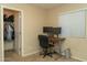 Home office featuring natural light from the window, desk, and closet providing a functional workspace at 10225 W Camelback Rd # 45, Phoenix, AZ 85037