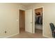Home office setup with a closet, a desk, and a chair, providing a functional workspace at 10225 W Camelback Rd # 45, Phoenix, AZ 85037