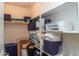 Organized walk-in pantry offers ample storage space on shelves for household goods at 10225 W Camelback Rd # 45, Phoenix, AZ 85037