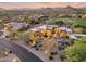 Expansive desert home with beautiful desert landscaping, mature trees, a nearby golf course, and stunning mountain views at 10664 E Monument Dr, Scottsdale, AZ 85262