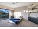 Bedroom with light walls, dark shelving, and a sliding glass door to the patio at 10664 E Monument Dr, Scottsdale, AZ 85262
