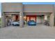 Three car garage featuring epoxy flooring, storage cabinets and a lift for the car enthusiast at 10664 E Monument Dr, Scottsdale, AZ 85262