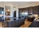 Well-appointed kitchen featuring a large island with counter seating, stainless steel appliances, and custom cabinetry at 10664 E Monument Dr, Scottsdale, AZ 85262