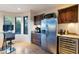 Well-equipped kitchenette with stainless steel appliances and wooden cabinets at 10664 E Monument Dr, Scottsdale, AZ 85262
