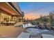 Backyard pool and spa area with sunset views, lounge seating, and desert landscaping at 10664 E Monument Dr, Scottsdale, AZ 85262