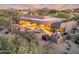 Expansive home featuring an outdoor pool, hot tub, patio with outdoor furniture and panoramic desert views at 10664 E Monument Dr, Scottsdale, AZ 85262