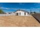 Large backyard of a white home featuring a block fence and space for customization at 11474 N 79Th Dr, Peoria, AZ 85345