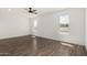 Well-lit bedroom featuring hardwood floors, neutral walls, and bright windows at 11474 N 79Th Dr, Peoria, AZ 85345