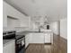 Modern kitchen featuring white cabinetry, stainless steel appliances, and sleek countertops at 11474 N 79Th Dr, Peoria, AZ 85345