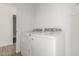 Clean laundry room featuring a washer and dryer with access to a second bathroom at 11474 N 79Th Dr, Peoria, AZ 85345