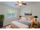 Cozy bedroom with natural light, complemented by tasteful decor and a ceiling fan at 1219 E Colter St # 8, Phoenix, AZ 85014