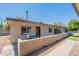 Exterior view of house with a wall, an outdoor grill, and a nicely kept walkway at 1219 E Colter St # 8, Phoenix, AZ 85014