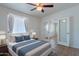 Serene main bedroom with neutral tones, complemented by a fan and natural light at 1219 E Colter St # 8, Phoenix, AZ 85014