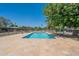 Beautiful community swimming pool surrounded by a deck, greenery, lounge chairs, and tables at 1219 E Colter St # 8, Phoenix, AZ 85014