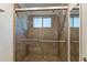 Modern tiled shower stall features dual shower heads and a window for natural light at 1219 E Colter St # 8, Phoenix, AZ 85014