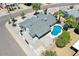 A charming home with a sparkling pool and well-maintained desert landscaping at 13215 N 30Th Pl, Phoenix, AZ 85032