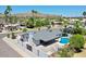 Aerial view showcases a pool, modern roof, desert landscaping and mountain views at 13215 N 30Th Pl, Phoenix, AZ 85032