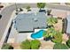Stunning aerial view showcasing a sparkling pool and lush landscaping at 13215 N 30Th Pl, Phoenix, AZ 85032