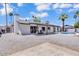 A charming home with a spacious backyard, patio, and sparkling pool surrounded by desert landscaping at 13215 N 30Th Pl, Phoenix, AZ 85032