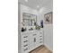 Bathroom featuring a vanity with drawers, modern black fixtures, and a well-lit mirror at 13215 N 30Th Pl, Phoenix, AZ 85032
