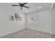 Cozy bedroom features a ceiling fan, natural light, and charming decorative accents at 13215 N 30Th Pl, Phoenix, AZ 85032